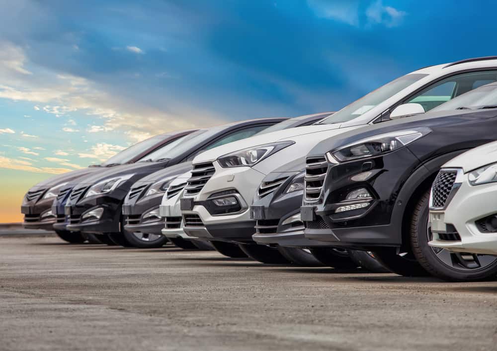 Image of a row of cars parked in a row for Car Loan.